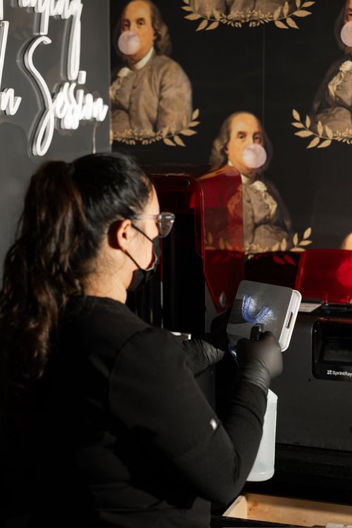 photo of one of the team members preparing a patient's clear aligner