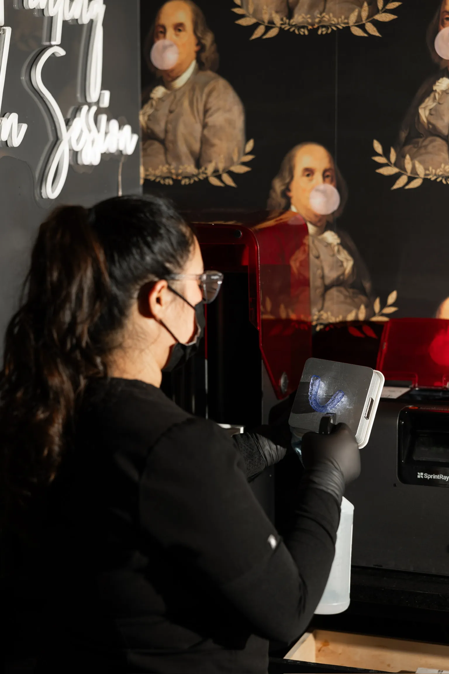 photo of one of the team members preparing a patient's clear aligner