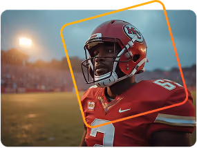 Football player in Kansas City Chiefs uniform and helmet on field during sunset.