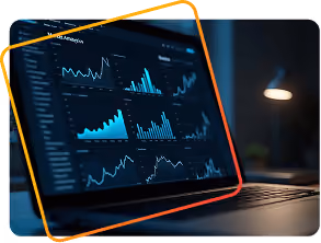 Laptop screen displaying various blue data charts and graphs in a dark environment.
