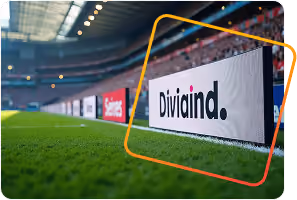 Advertising board with text 'Divitalind' on the edge of a green soccer field in a stadium.