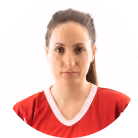 Portrait of a woman with tied-back hair wearing a red shirt with white trim.