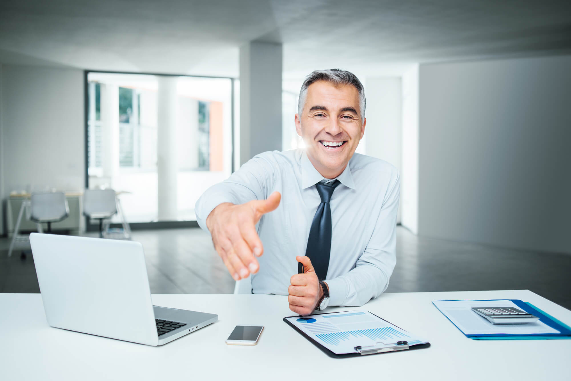 business leader giving a handshake to a marketer from an SEO company in Florida