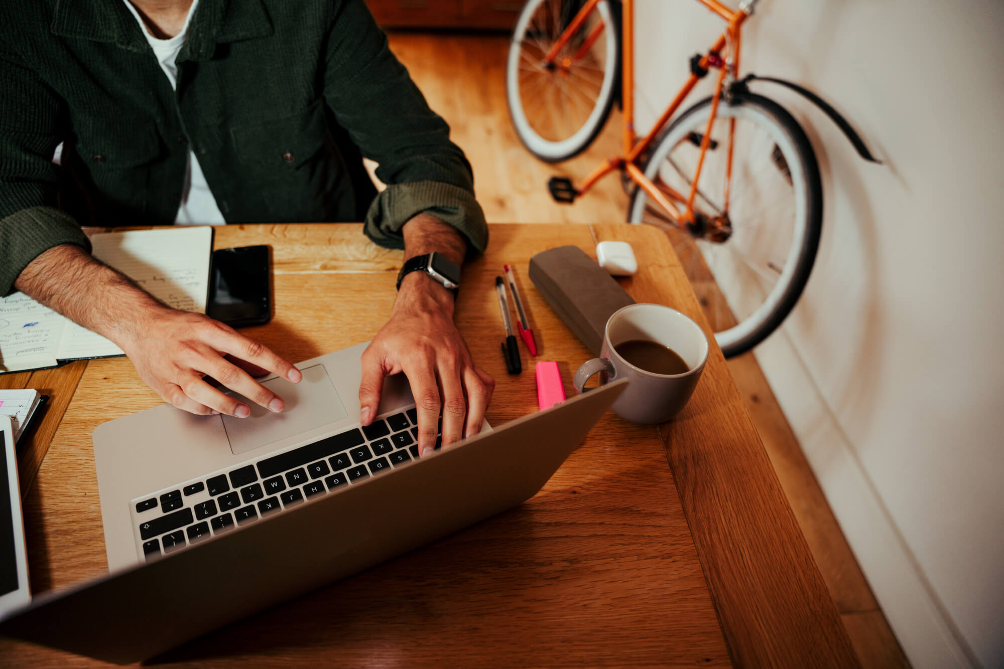a businessman replying to emails via laptop