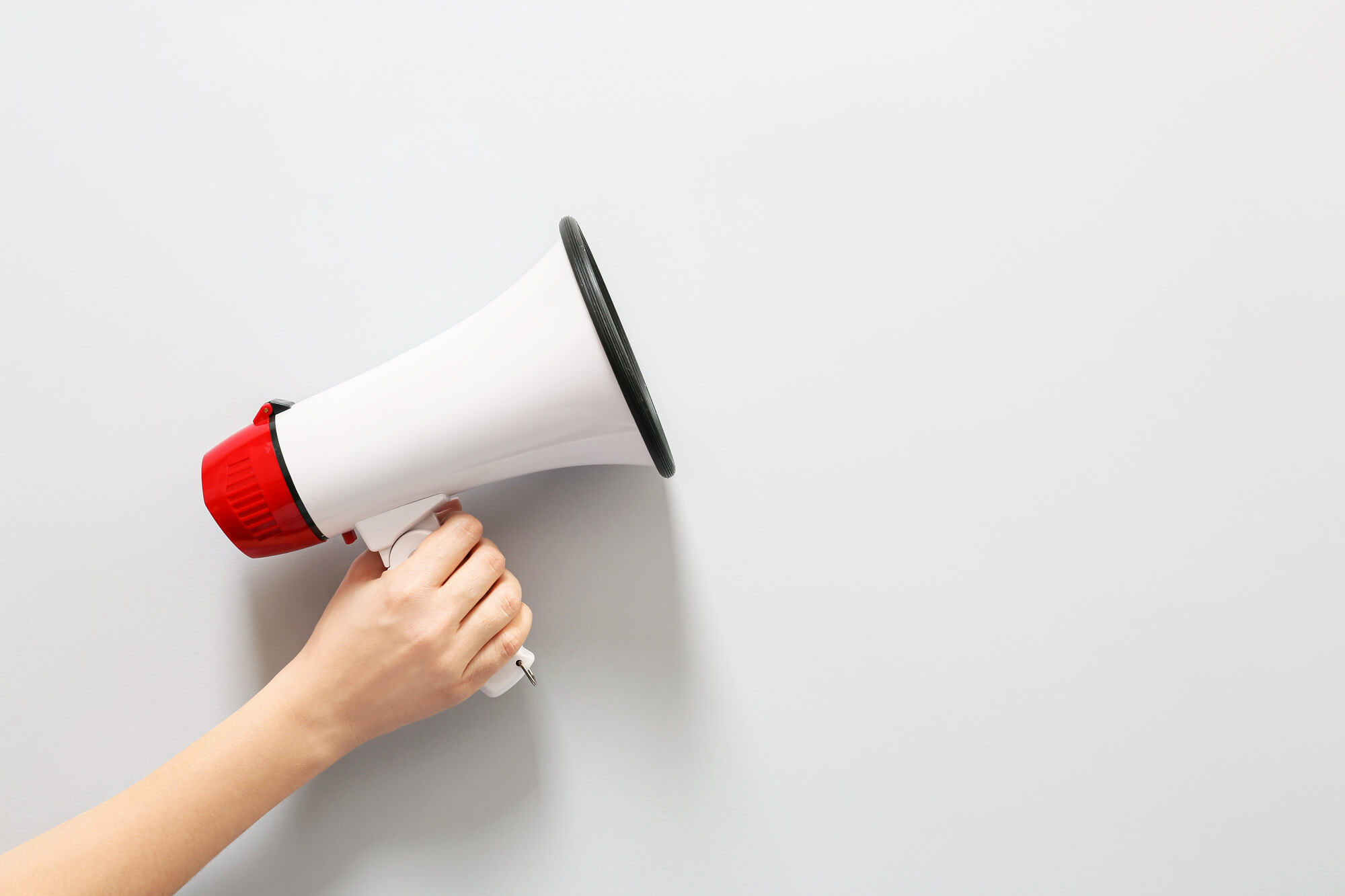 hand with megaphone on white background