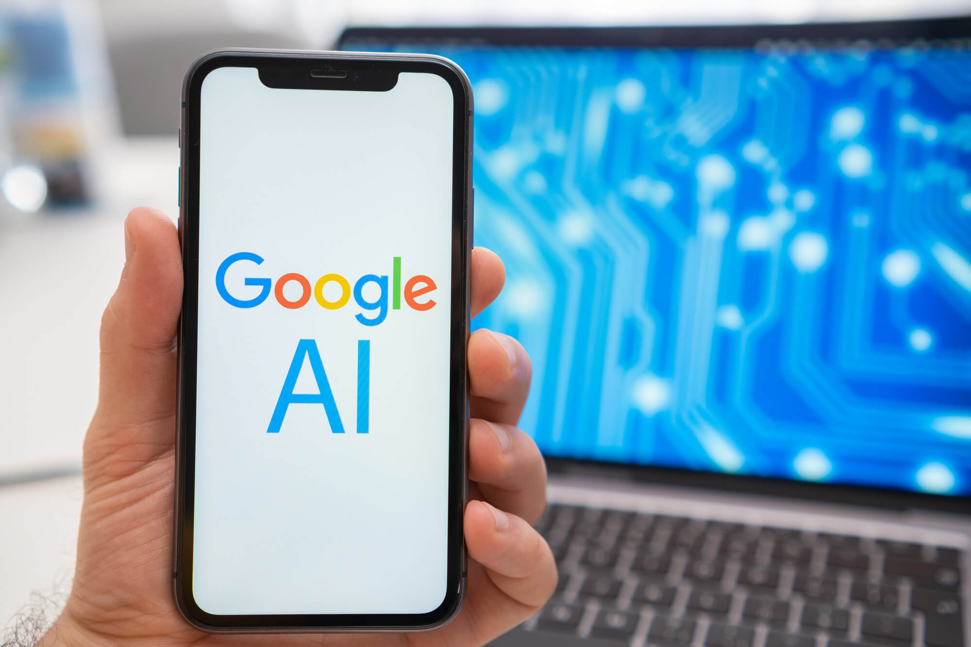 hand holding phone with google ai on screen