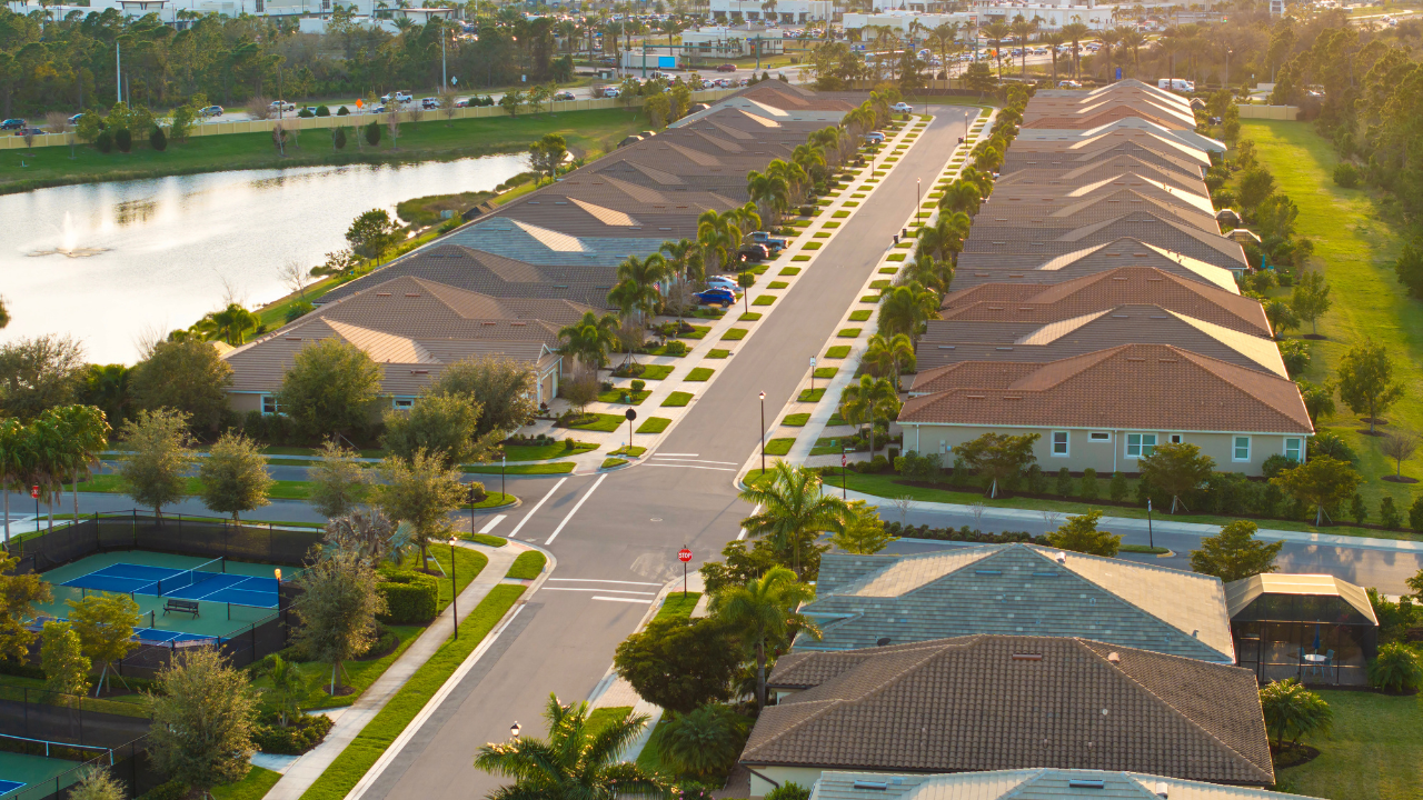 Aerial view of a well-maintained Venice, FL neighborhood near waterways.