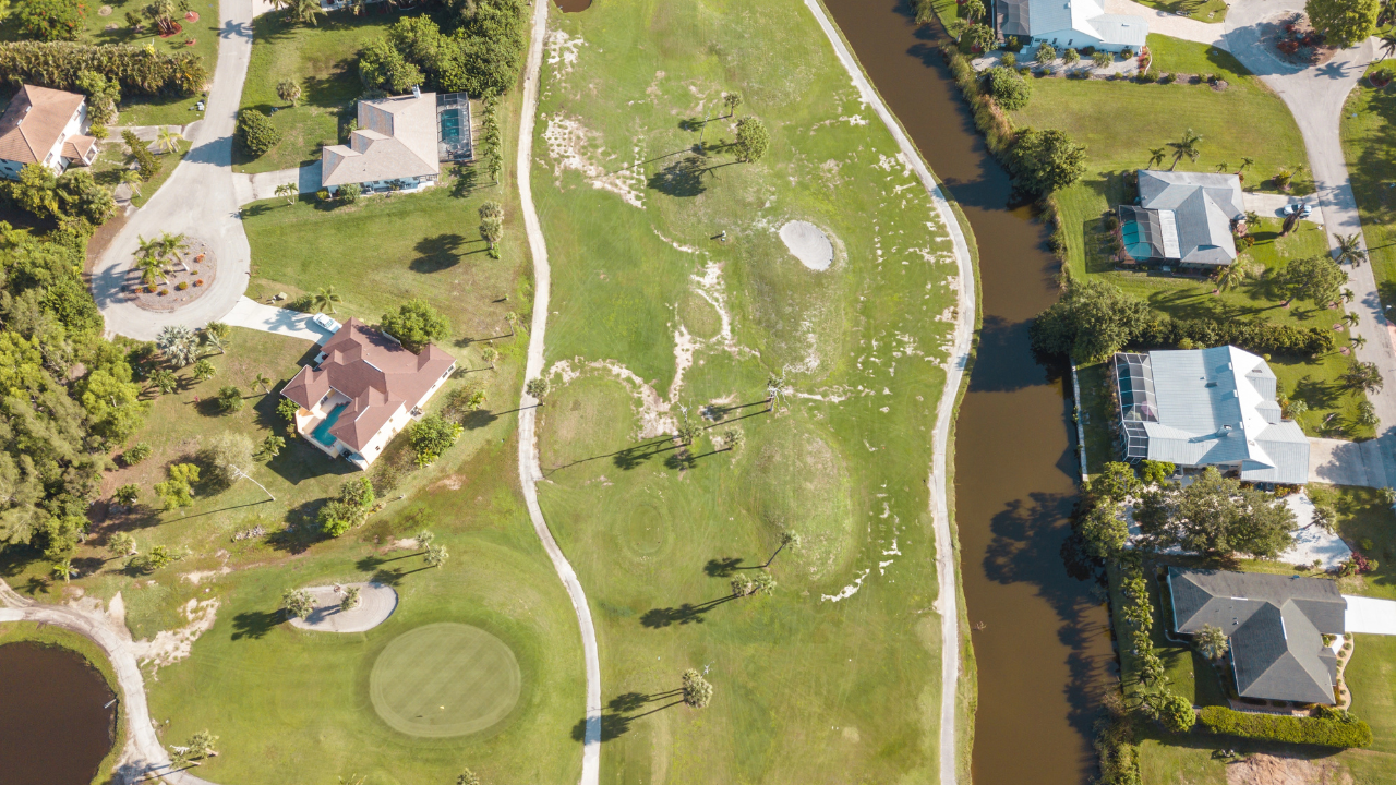 Aerial view of Lakewood Ranch, FL, showcasing beautiful homes, green spaces, and lakes.