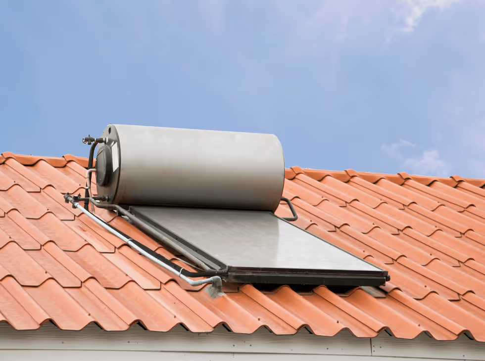 a person working on a solar panel with a blue sky in the background