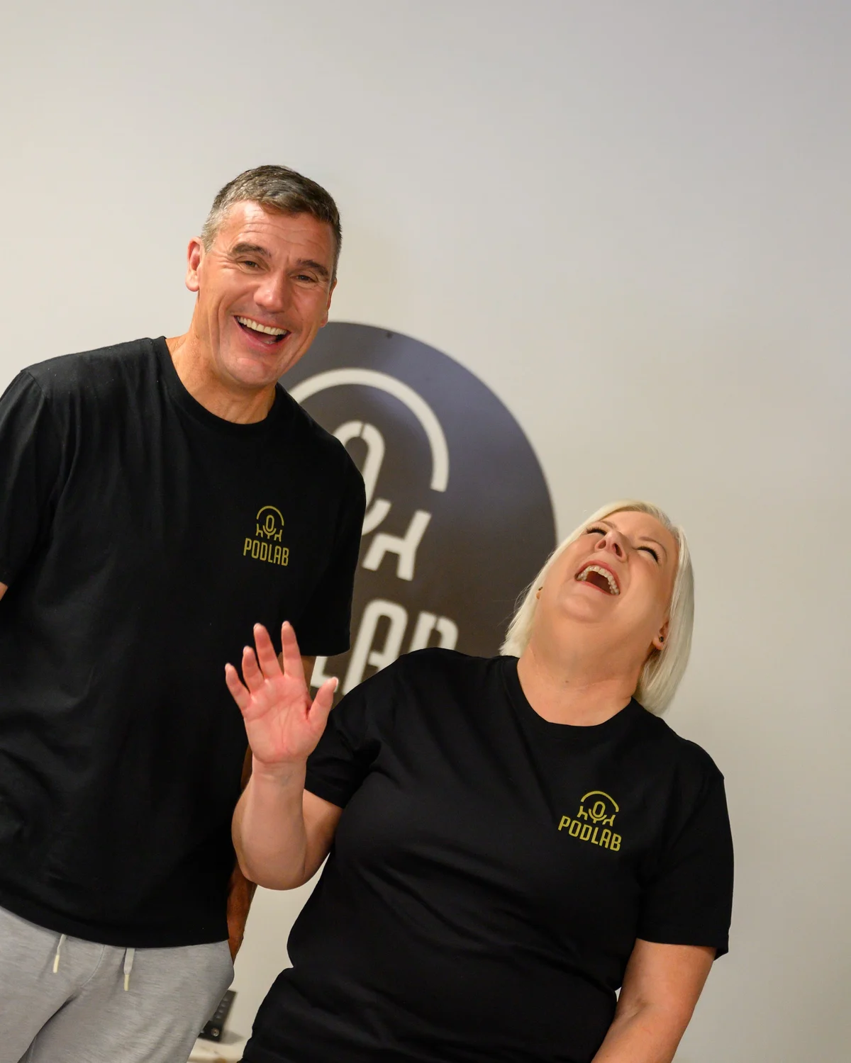 PodLab owners Jay-Jay Feeney and Dom Harvey laughing together in their studio