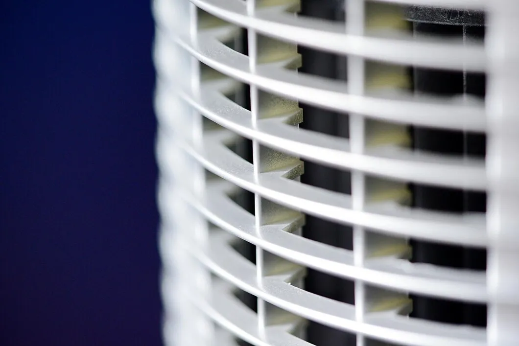 Valley Air Conditioning & Repair, Inc. close-up of a white air purifier or fan with curved plastic grille and horizontal slats