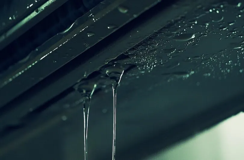 A close shot of dripping water from an AC 