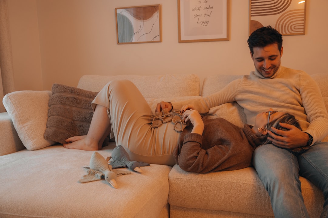 A family relaxing comfortably in their living room - HVAC system maintenance A family relaxing comfortably in their living room - HVAC system maintenance