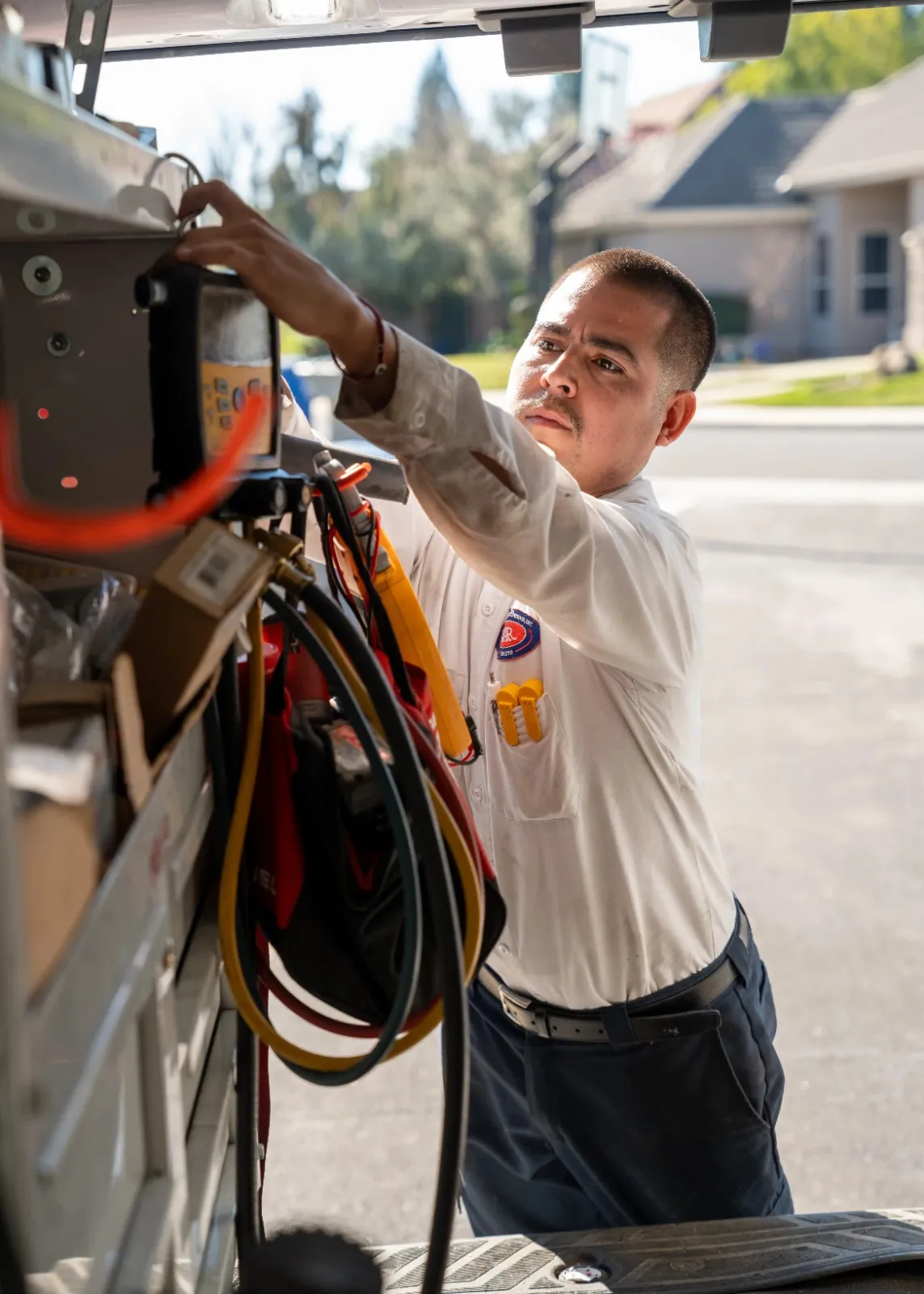 Image of a technician unloading repairing kits