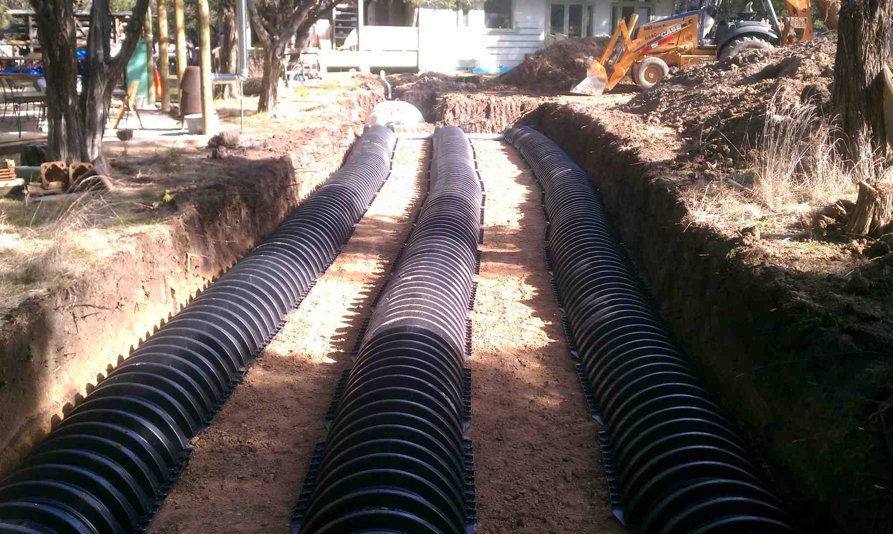 I need to find a specialist in drain field repair. Who serves the Bulverde, TX area?