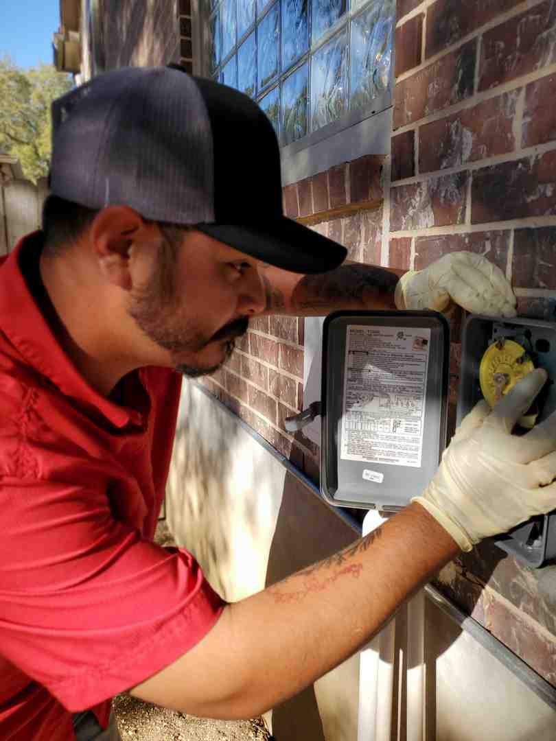 An activated red alarm light on an aerobic system control box, with brand colors #fe0103, #ffffff, #000000 - aerobic system repair garden ridge tx