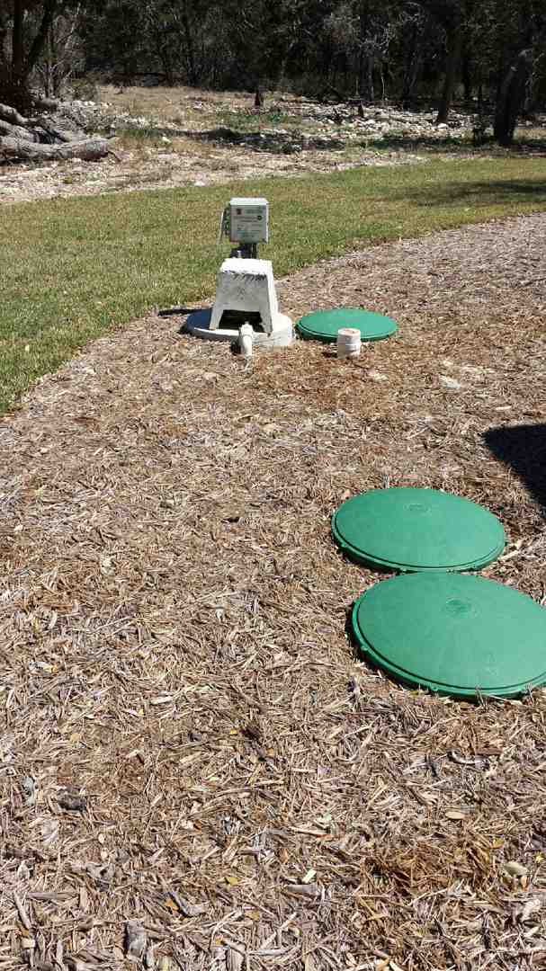 A clean, easily accessible septic tank lid surrounded by well-maintained landscaping - affordable septic system installation service in boerne tx A clean, easily accessible septic tank lid surrounded by well-maintained landscaping - affordable septic system installation service in boerne tx