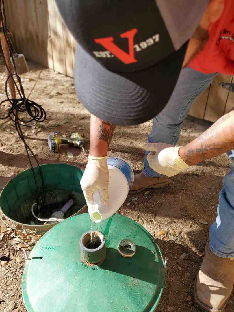 technician accessing septic tank through riser - septic riser installation grey forest tx technician accessing septic tank through riser - septic riser installation grey forest tx