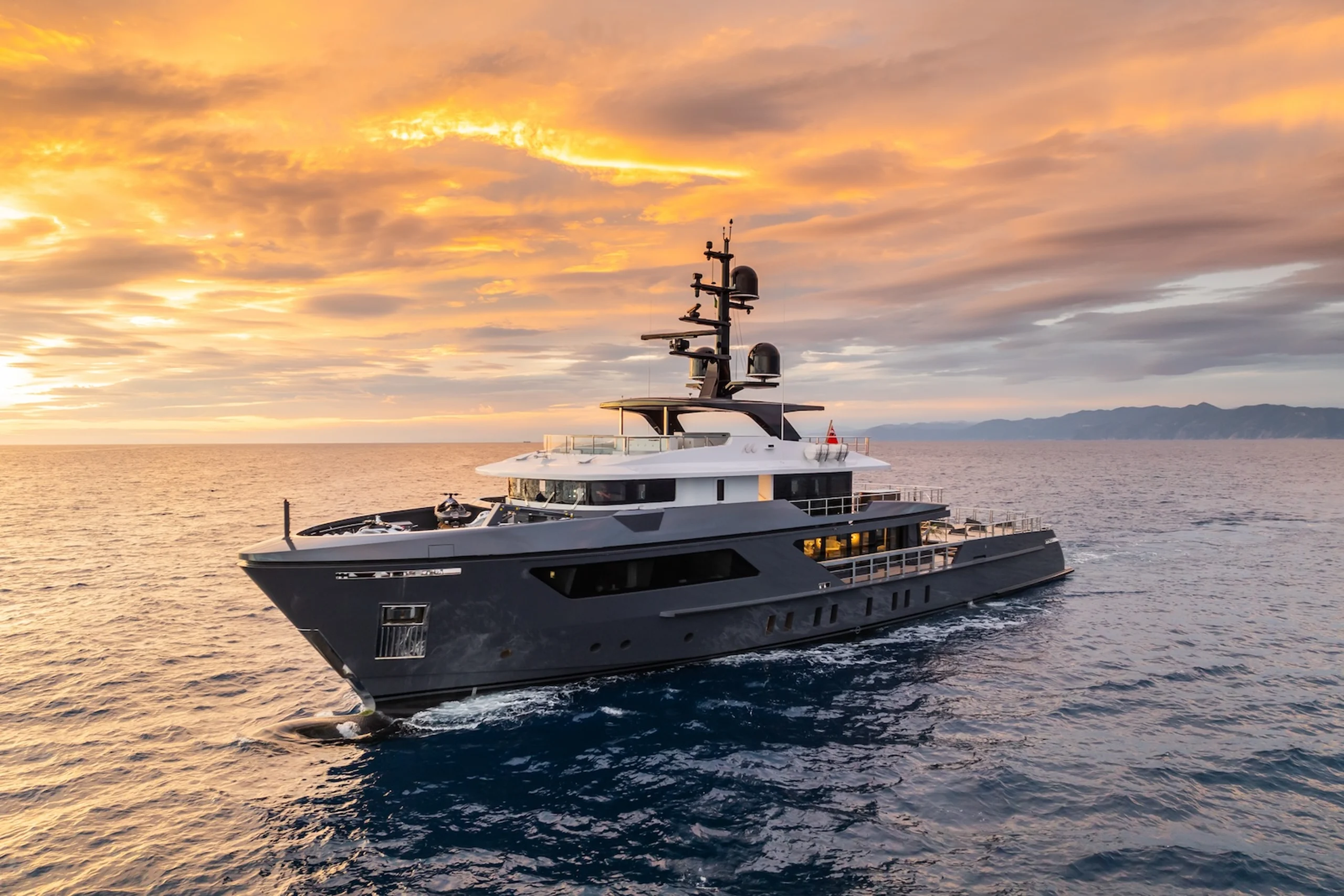 Motor Yacht M port side at sunset