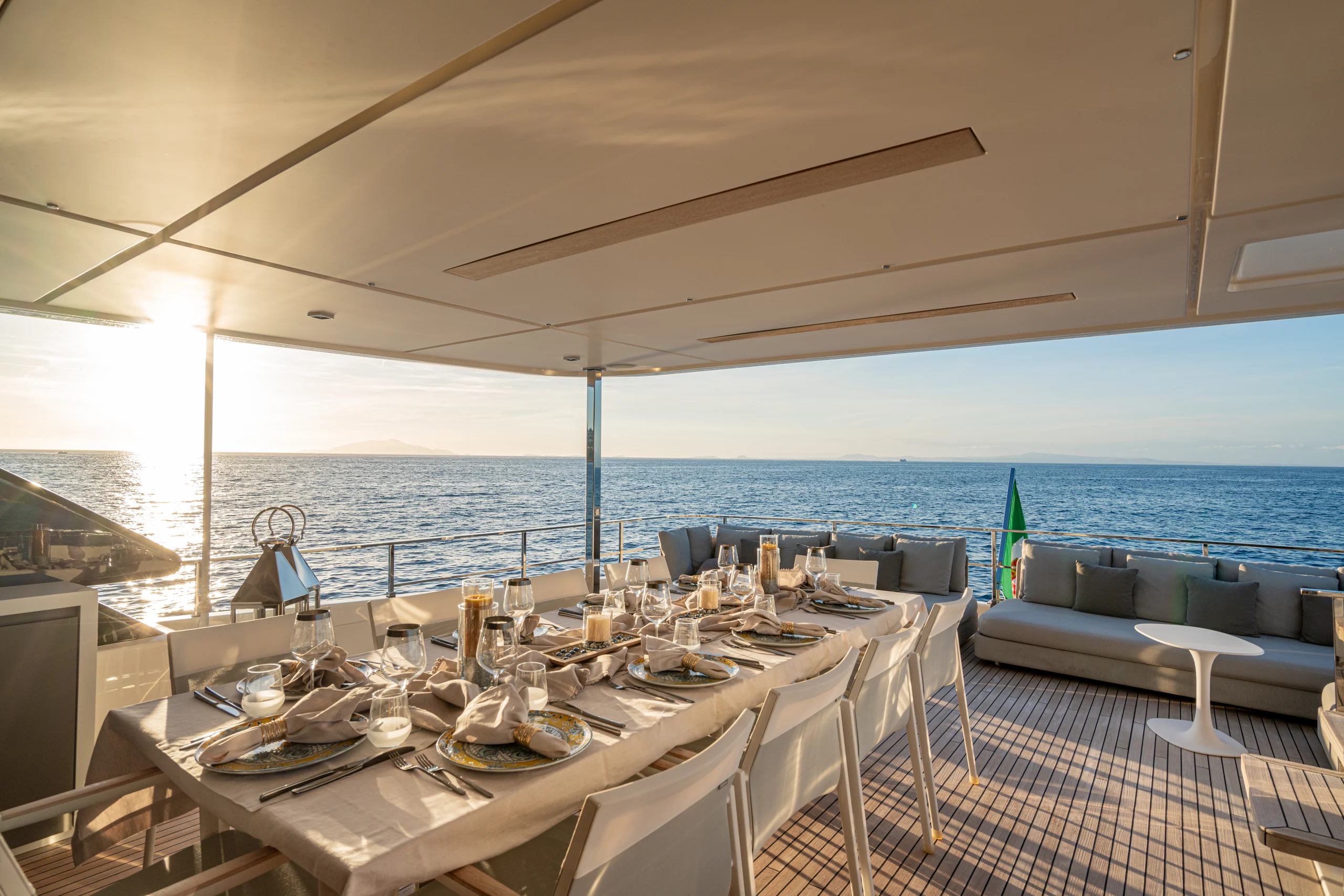 SOUTH - Ferretti Custom Line Navetta 33 aft deck alfresco dining