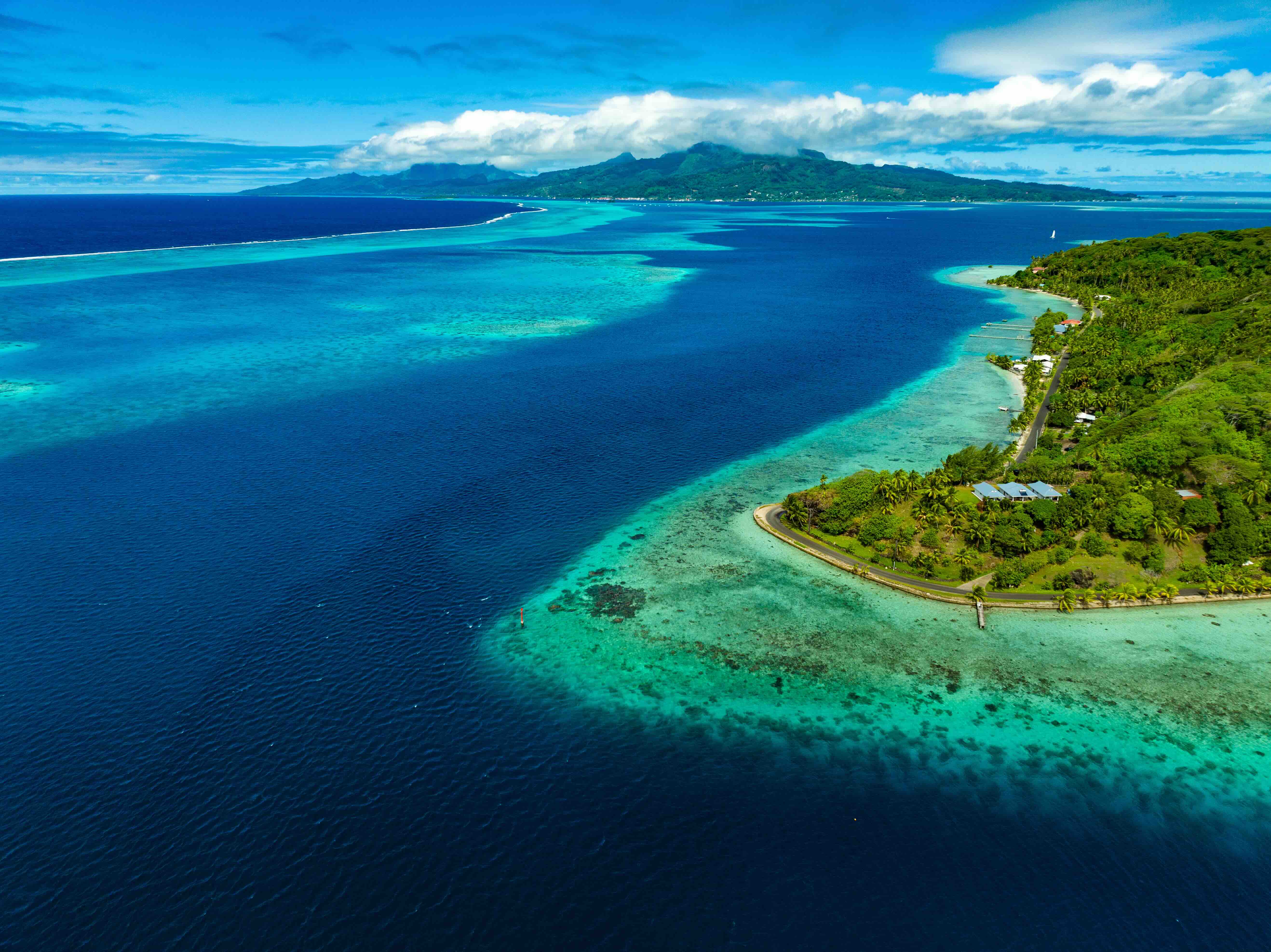 Aerial view of Raiatea and Tahaa lagoons in the Society Islands, French Polynesia, a premier destination for Tahiti yacht charters.