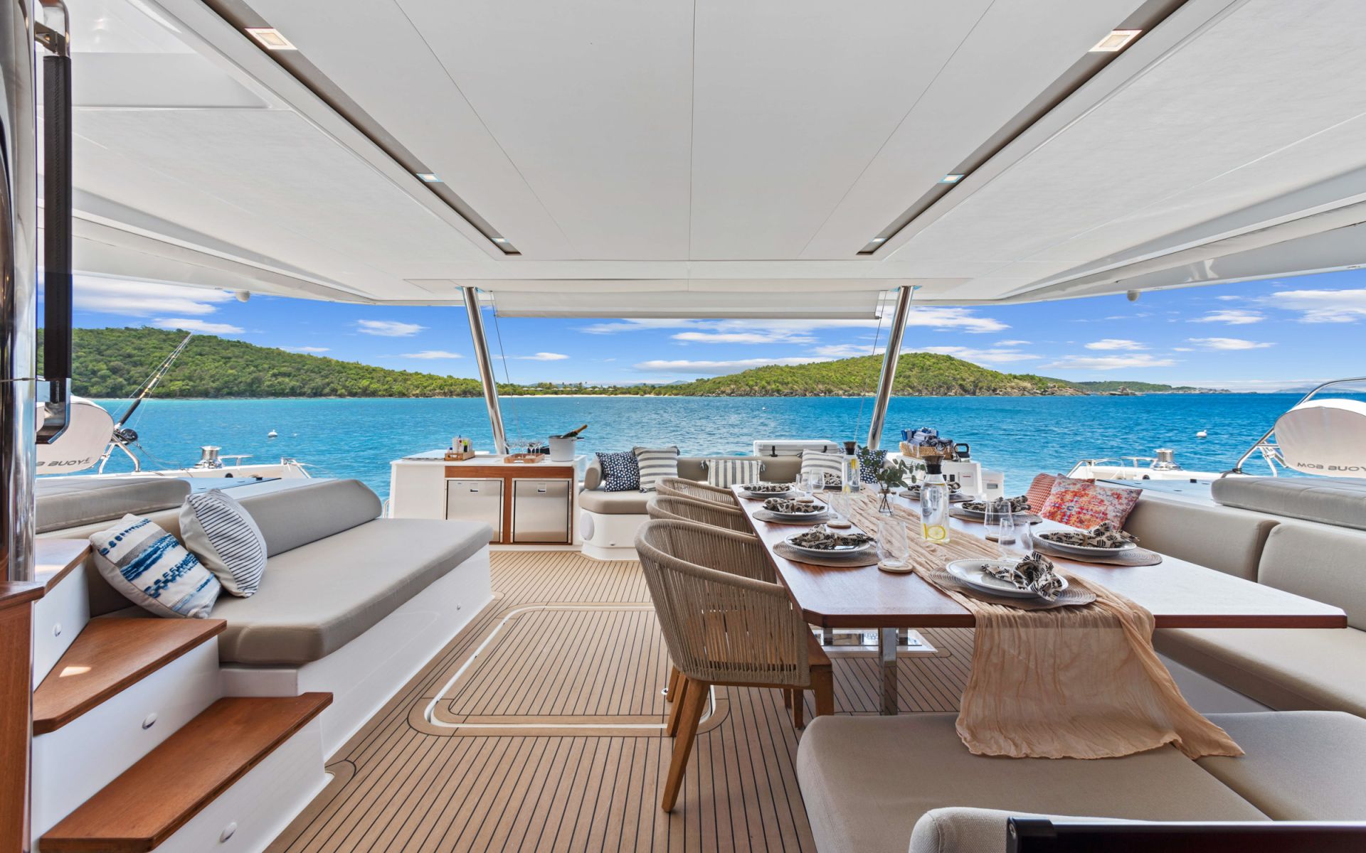 HOURGLASS - BVI Crewed Catamaran - Fountaine Pajot Samana 59 aft deck dining area