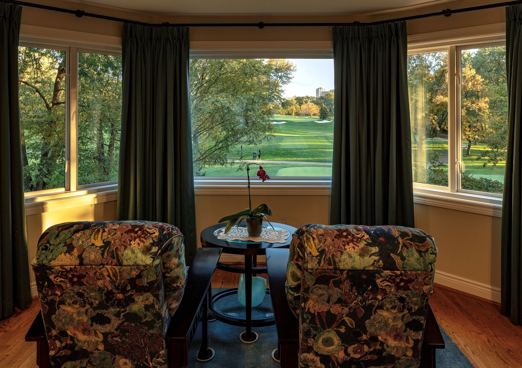 room with armchairs and bay windows