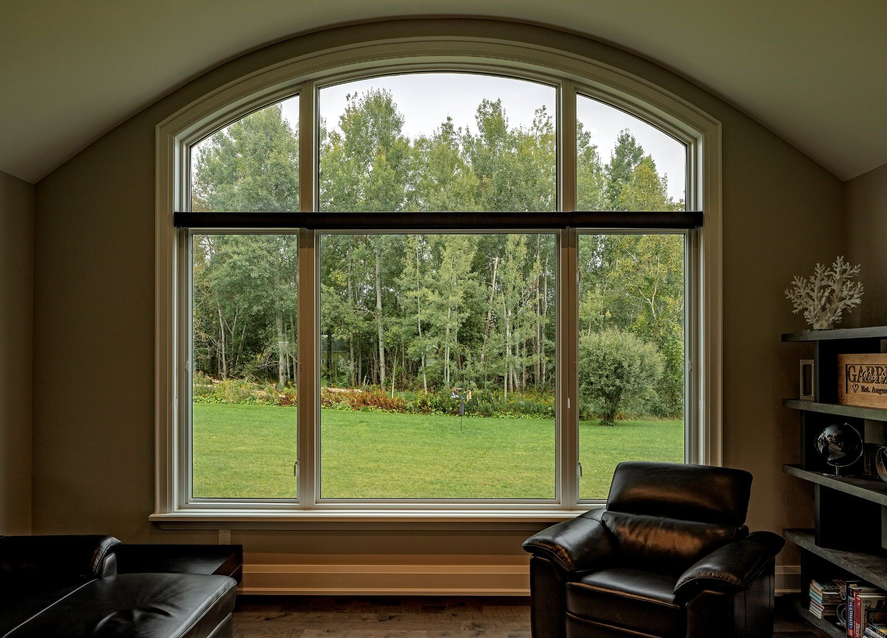 room with a large elliptical arched window