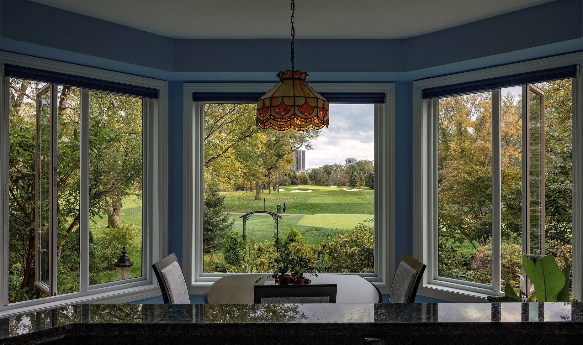 dining room with traditional bay windows