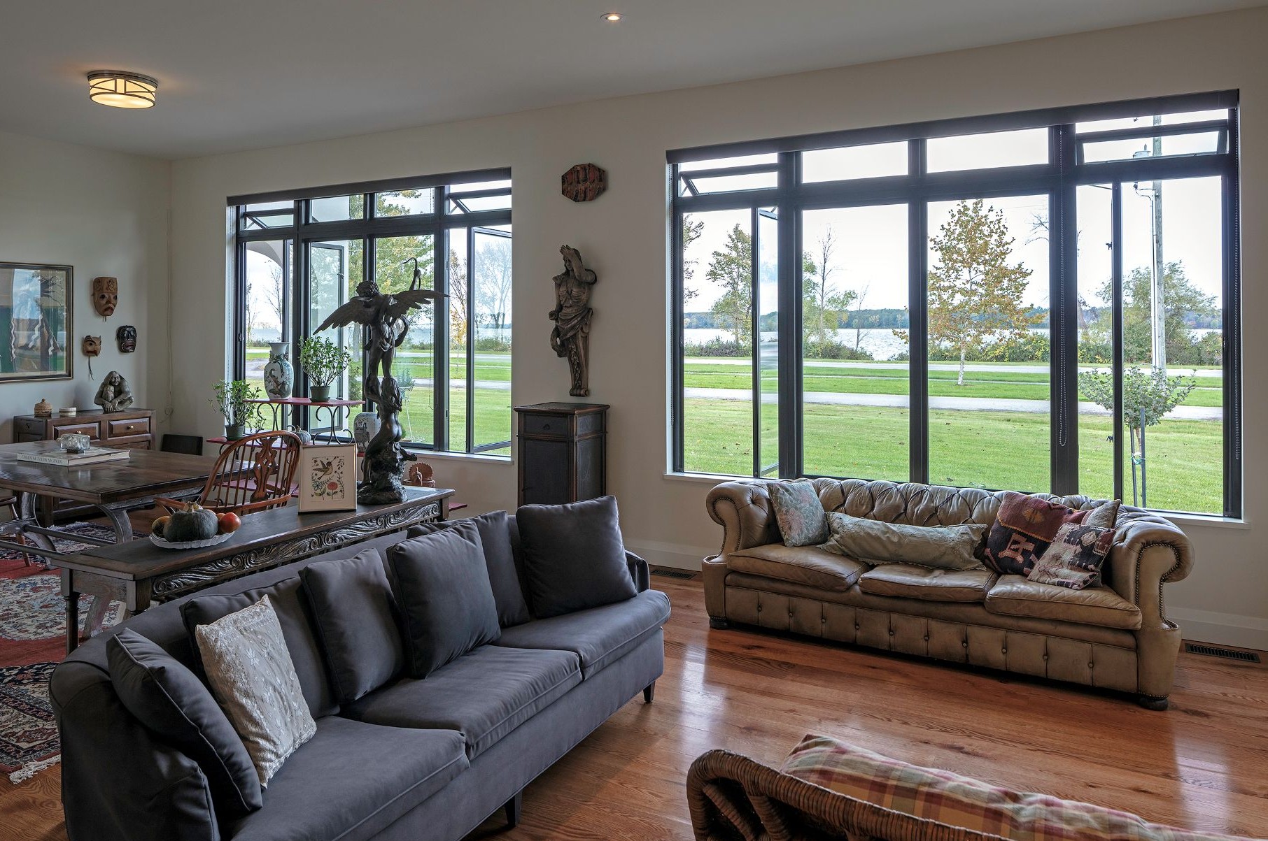 living room with awning windows installed above casement windows