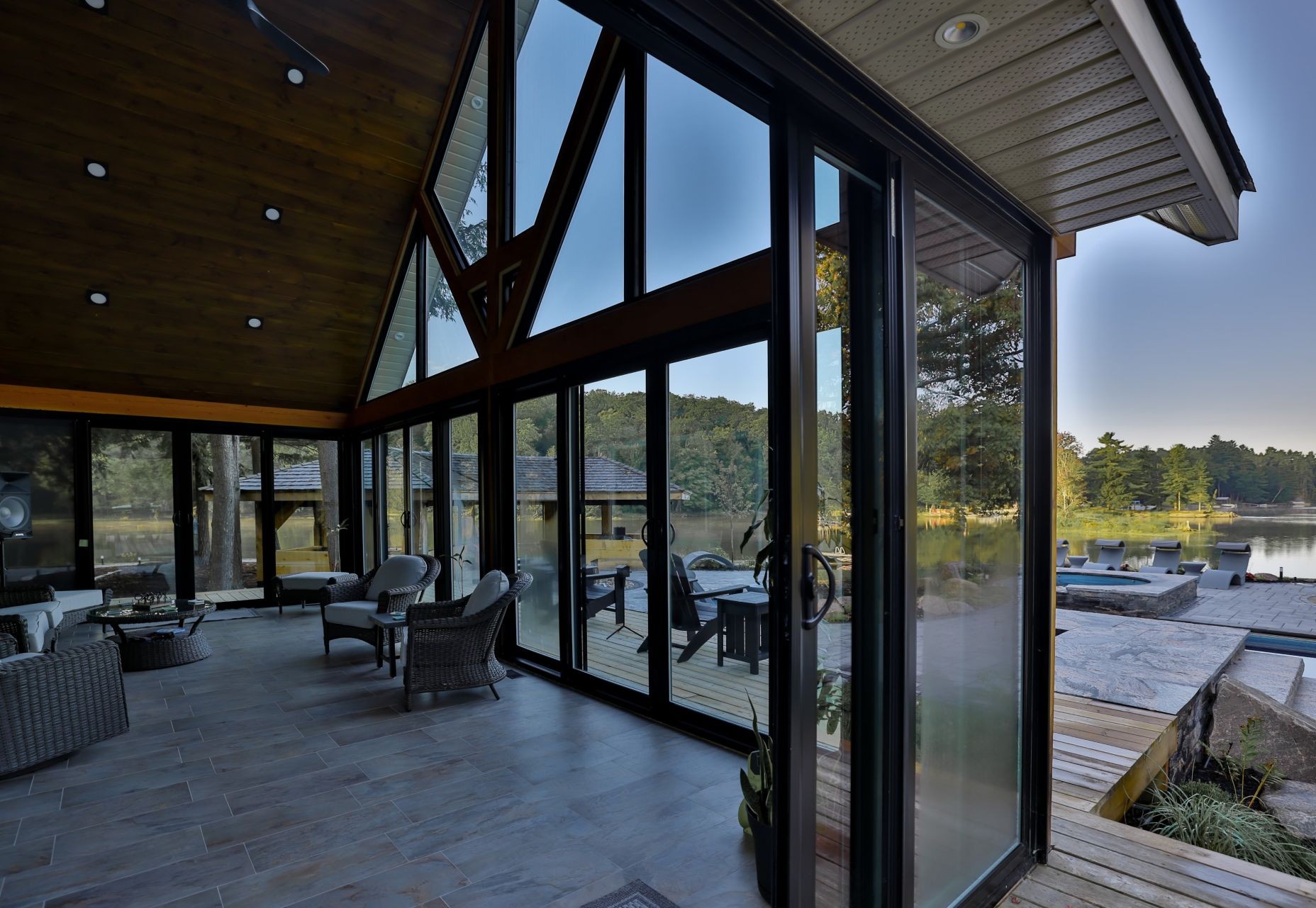 interior of a house with large black windows of different shapes