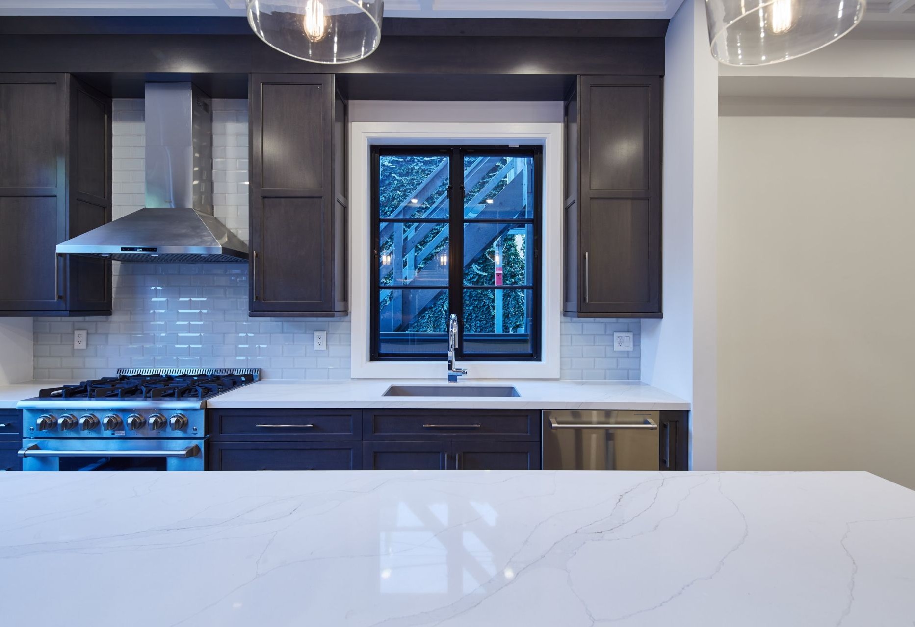 kitchen with black vinyl window above the sink