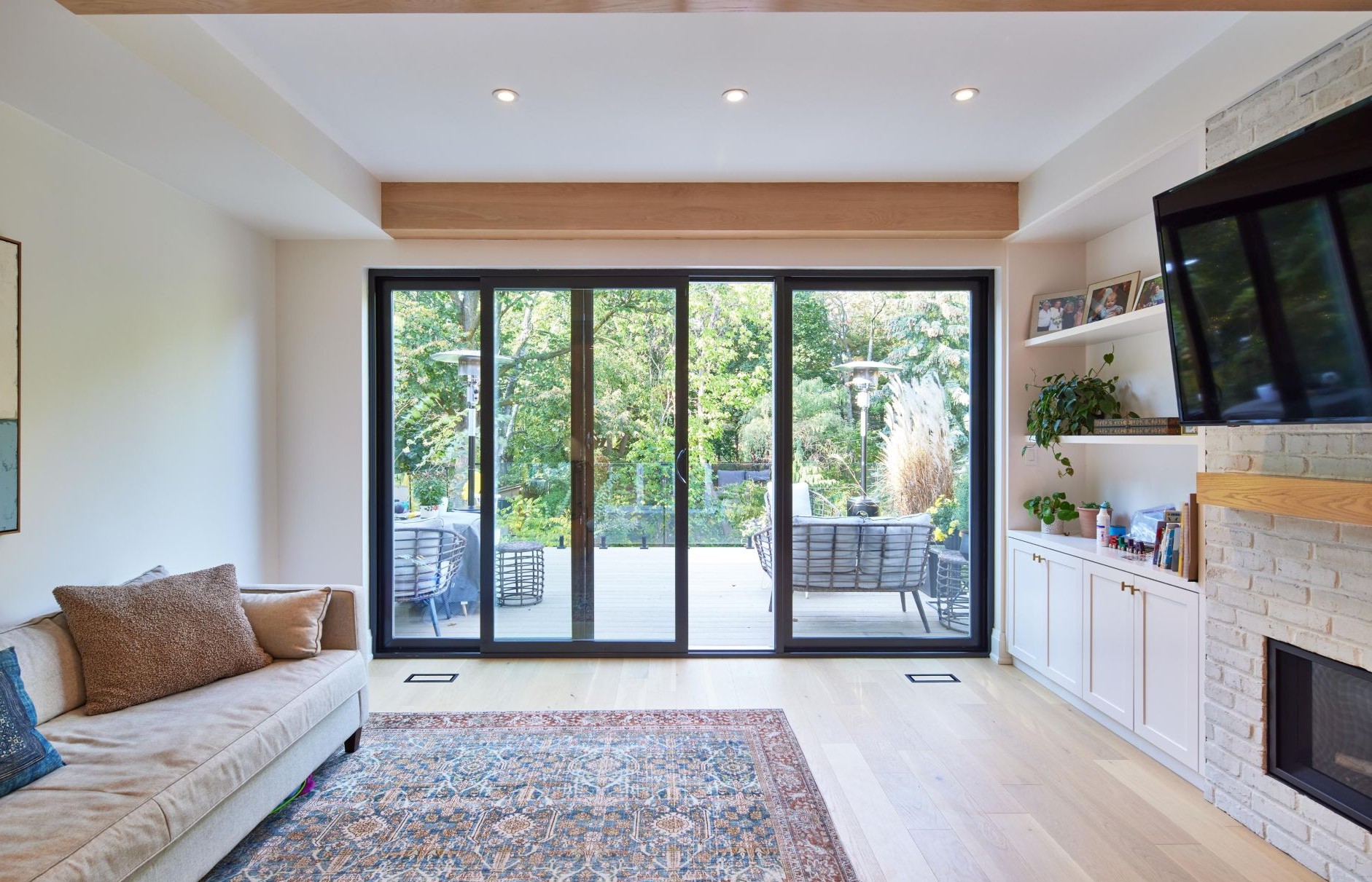 living room with a 3-panel sliding door