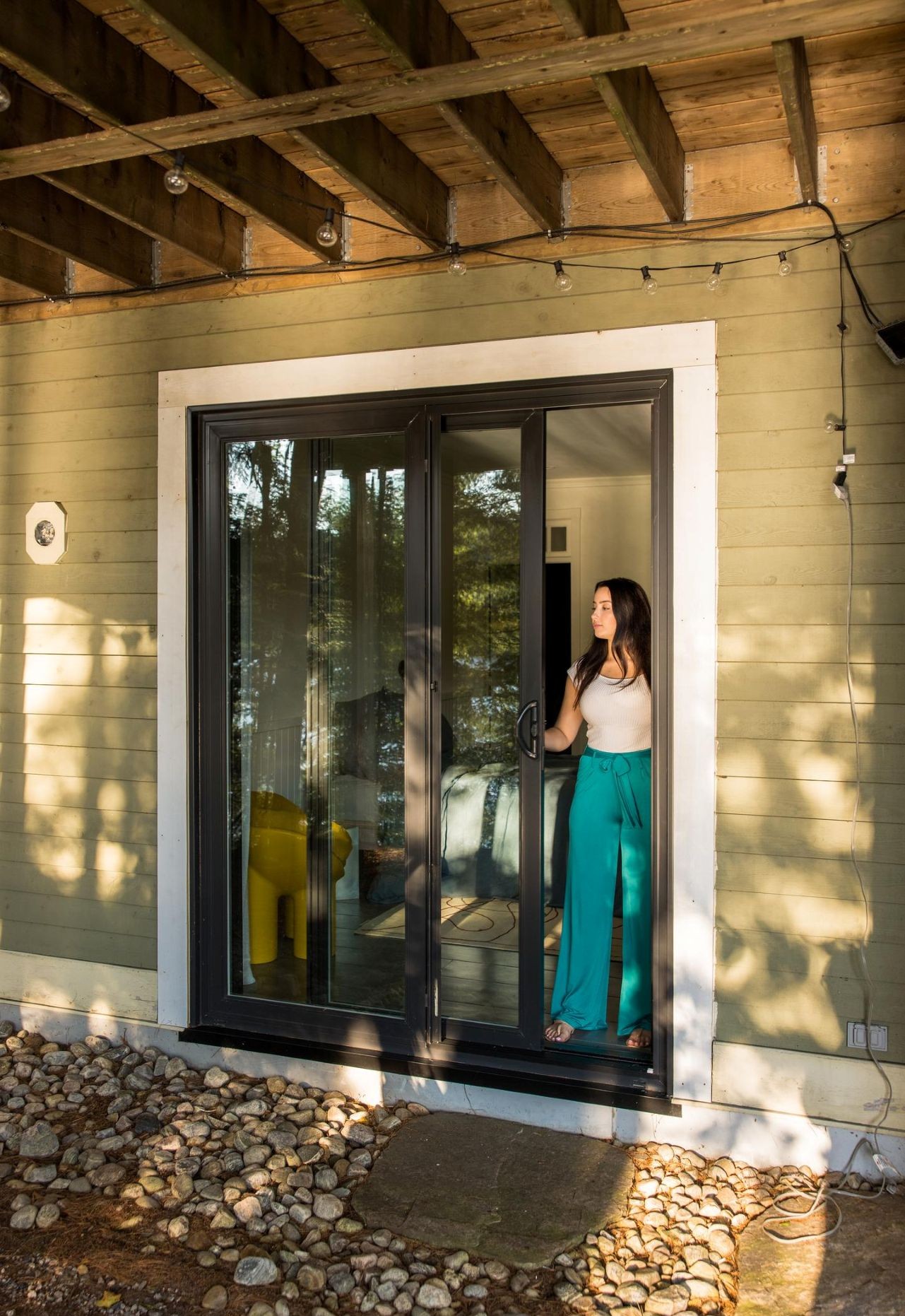 woman opening a two-panel sliding door