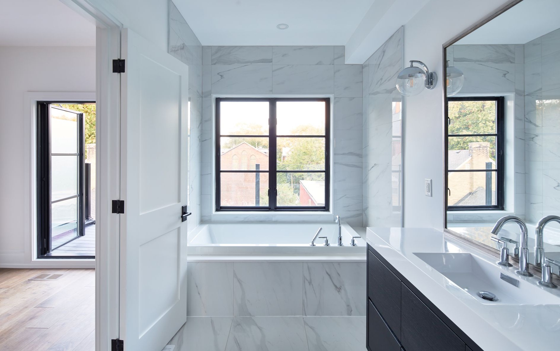 standard-sized casement window above bathtub