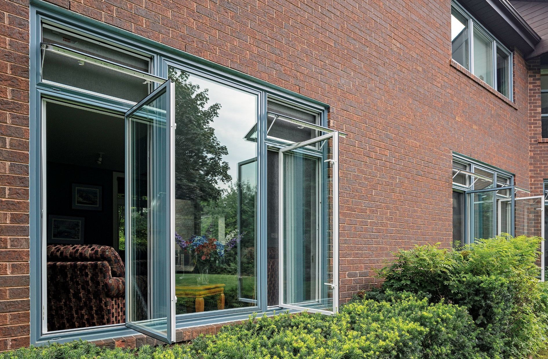 two egress casement windows with two awning windows on top and a fixed window separating them