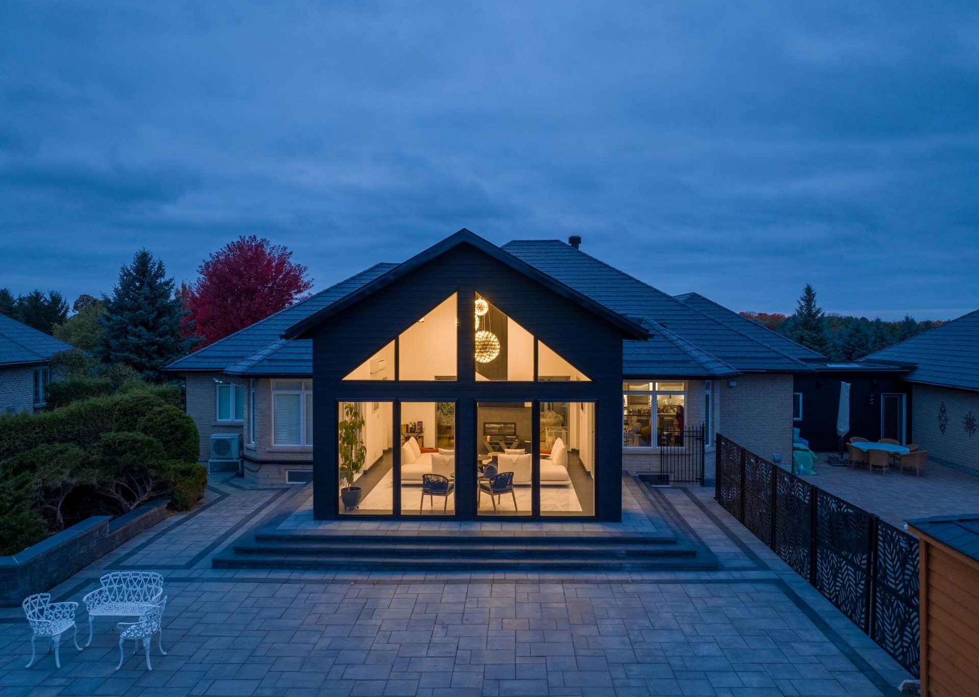 home with interior lights on at night