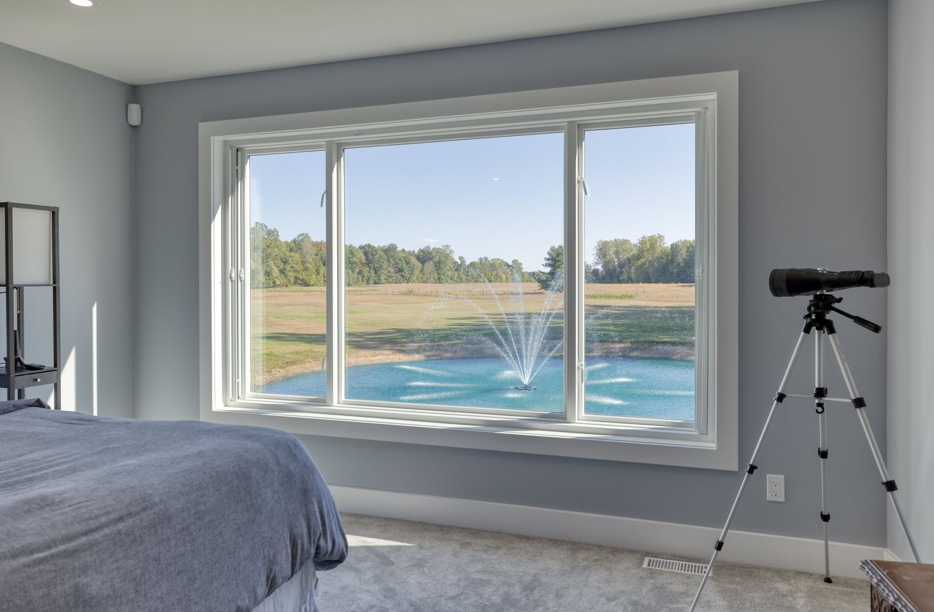 bedroom with two casement windows separated by a picture window