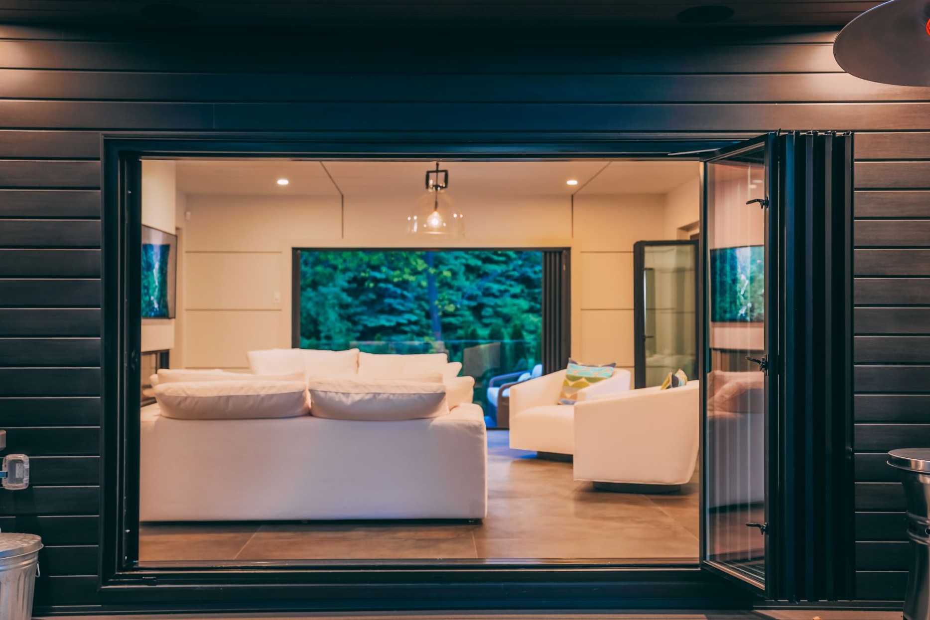 bifold sliding door connecting living room to patio