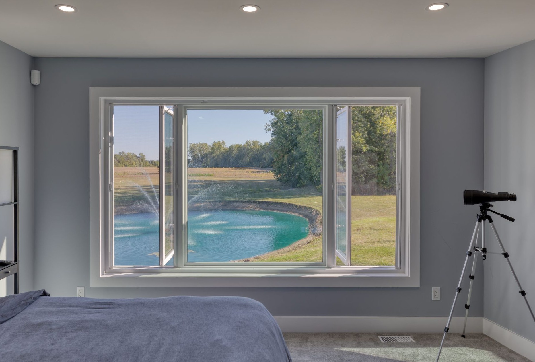 bedroom with two casement windows separated by a picture window