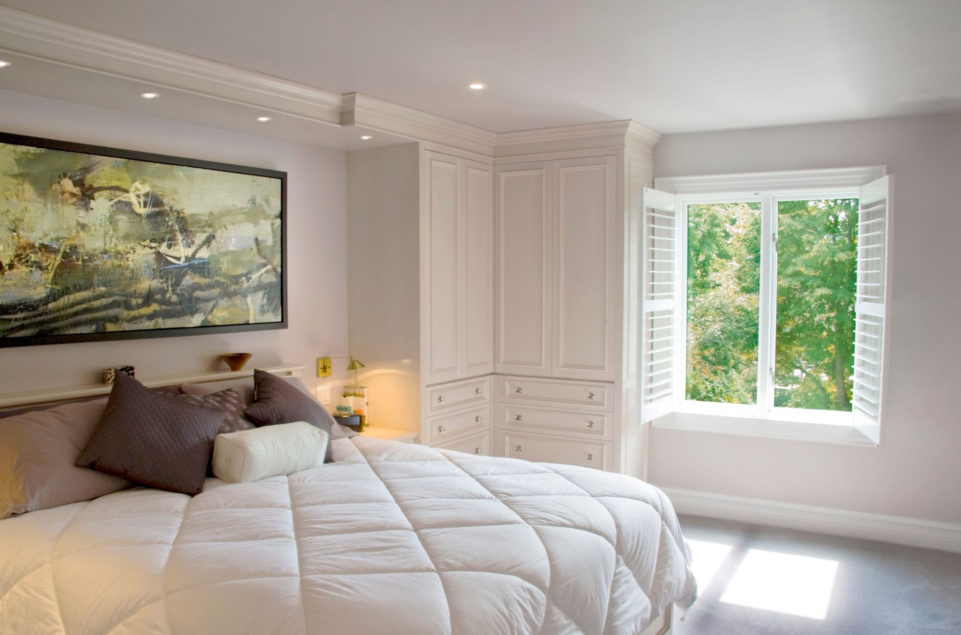 bedroom with plantation shutters covering the window