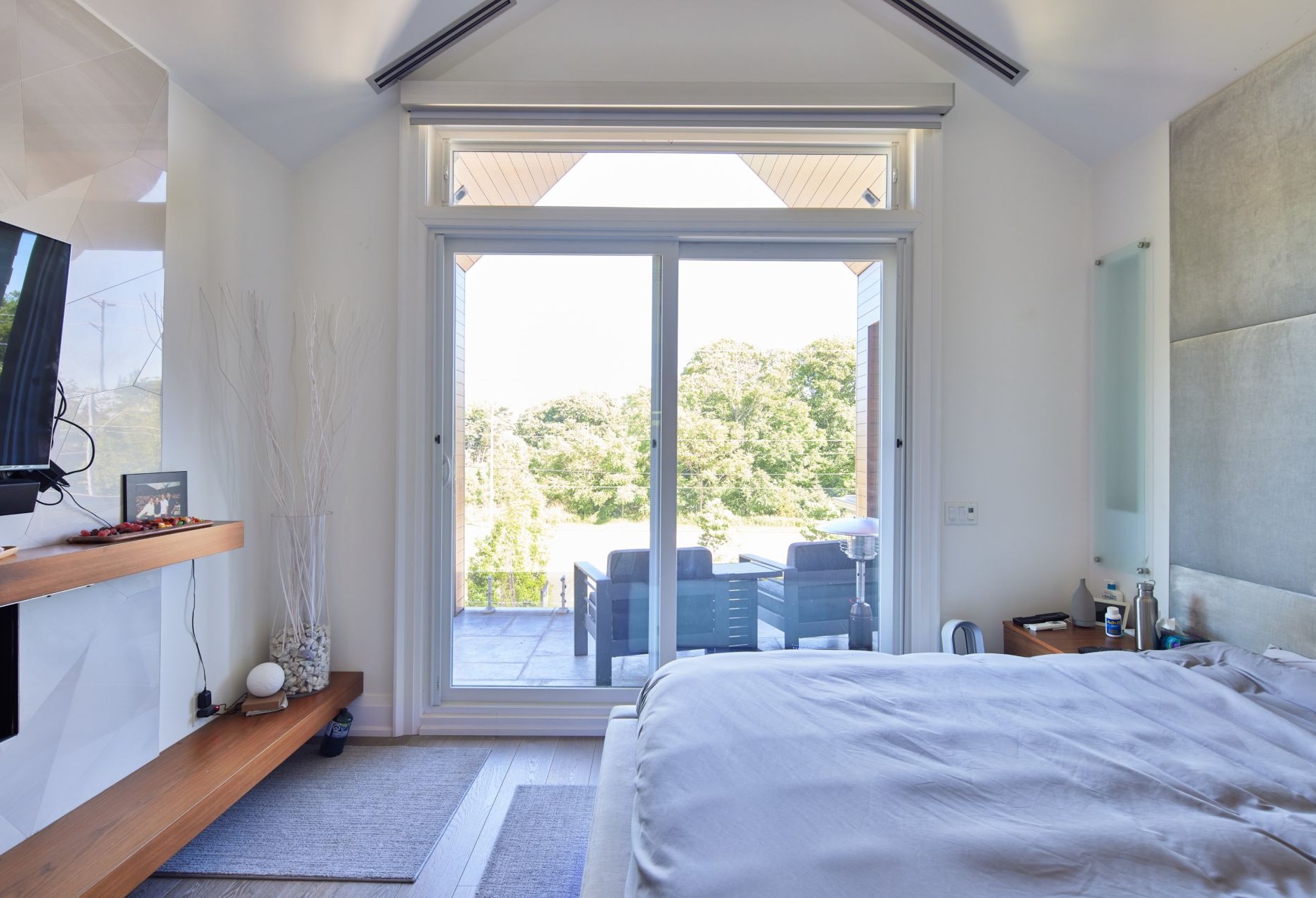 roller shades installed on sliding doors in bedroom