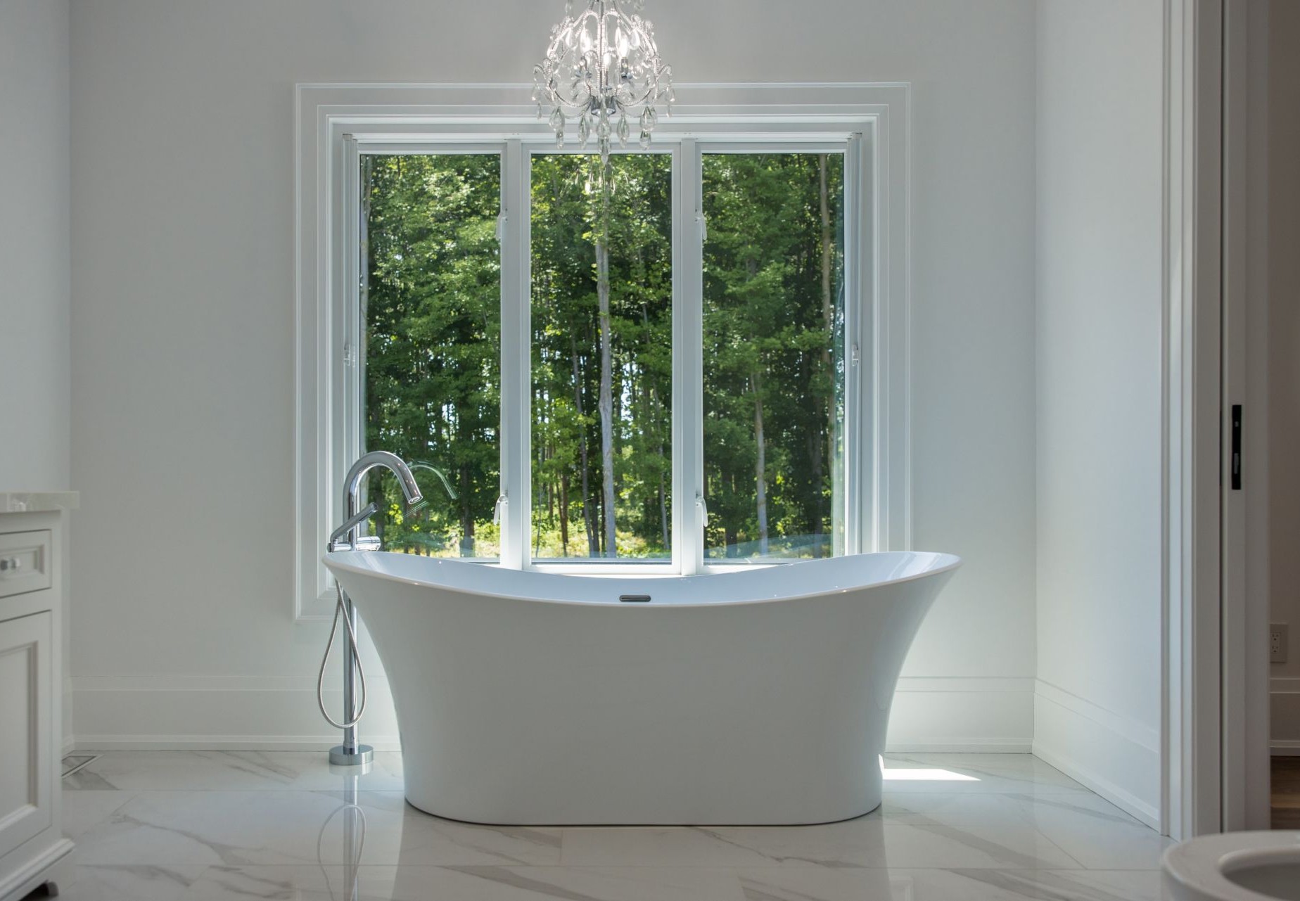 bathroom with casement windows near bathtub