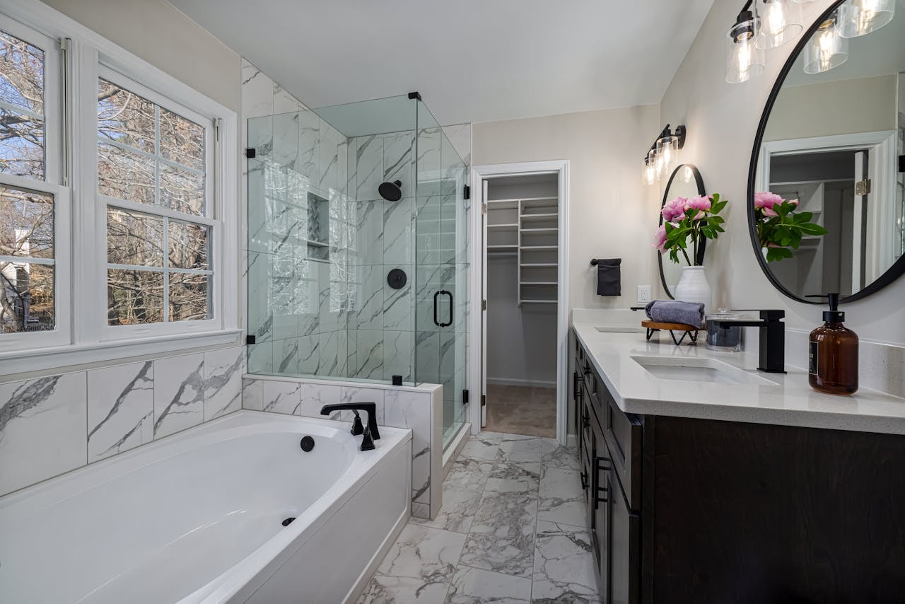 large bathroom with hung window above bathtub