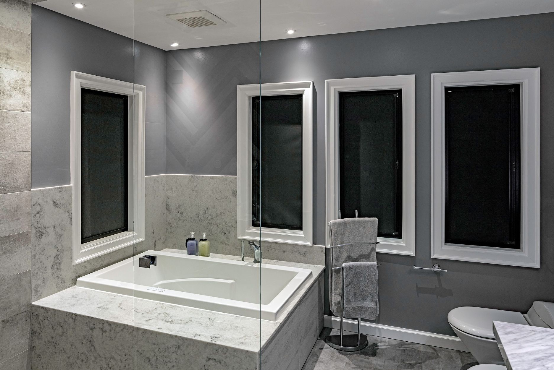 four casement windows with thermal blinds as window treatments