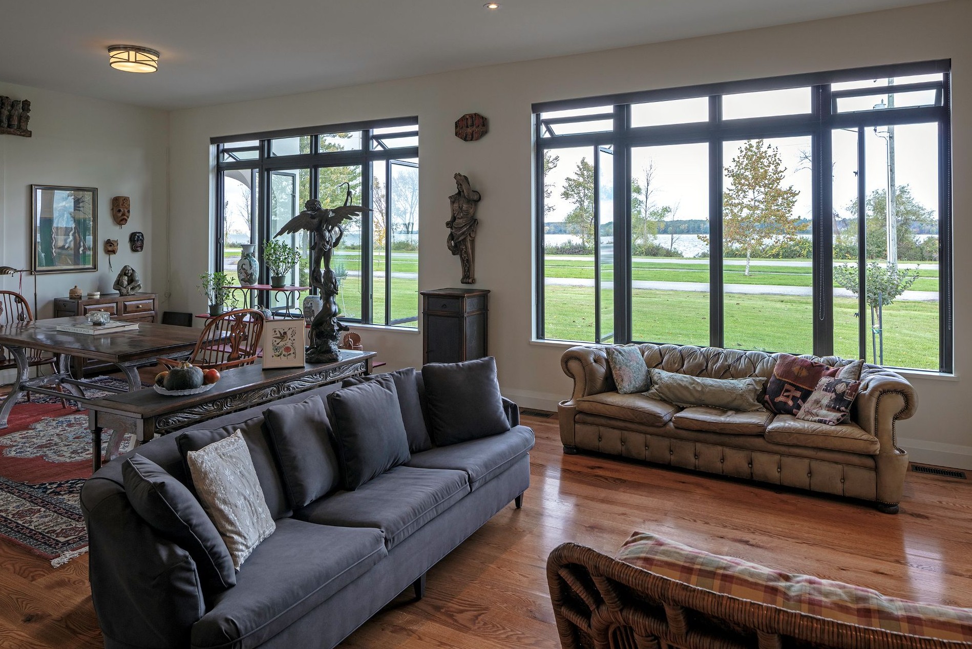 living room with multiple awning windows and casement windows
