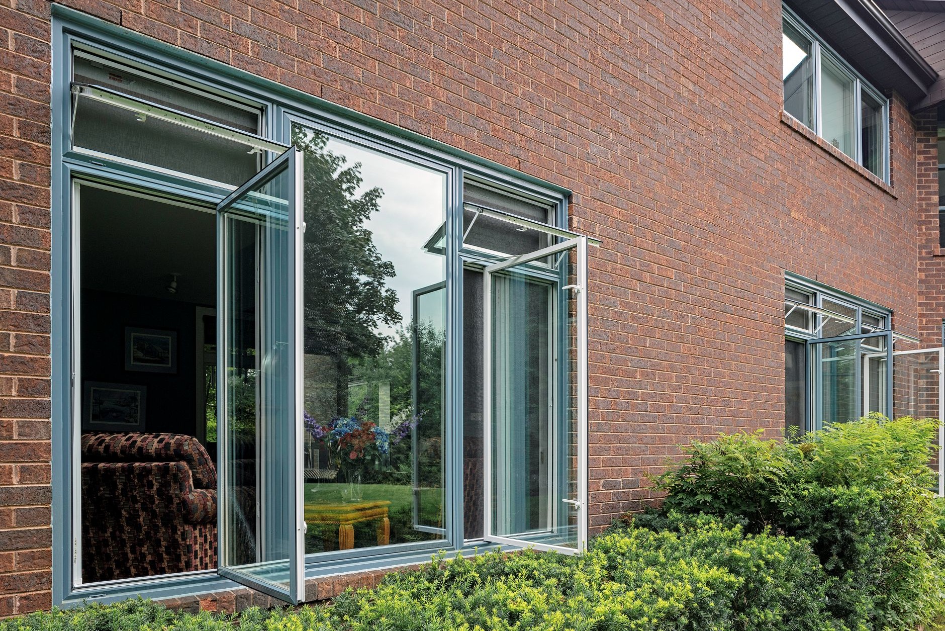 two casement windows with awning windows on top