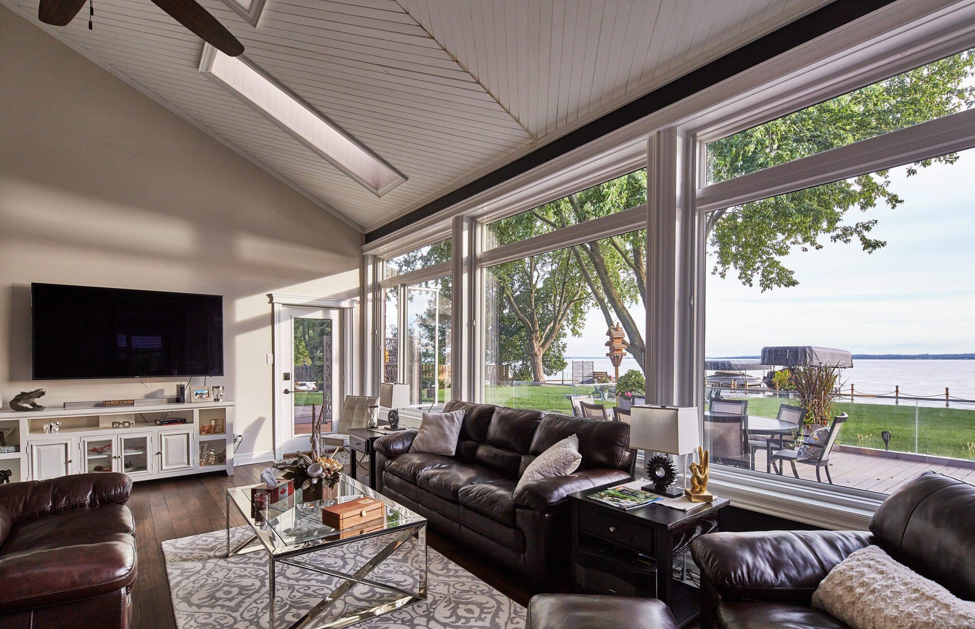 large living room with picture windows and transom windows