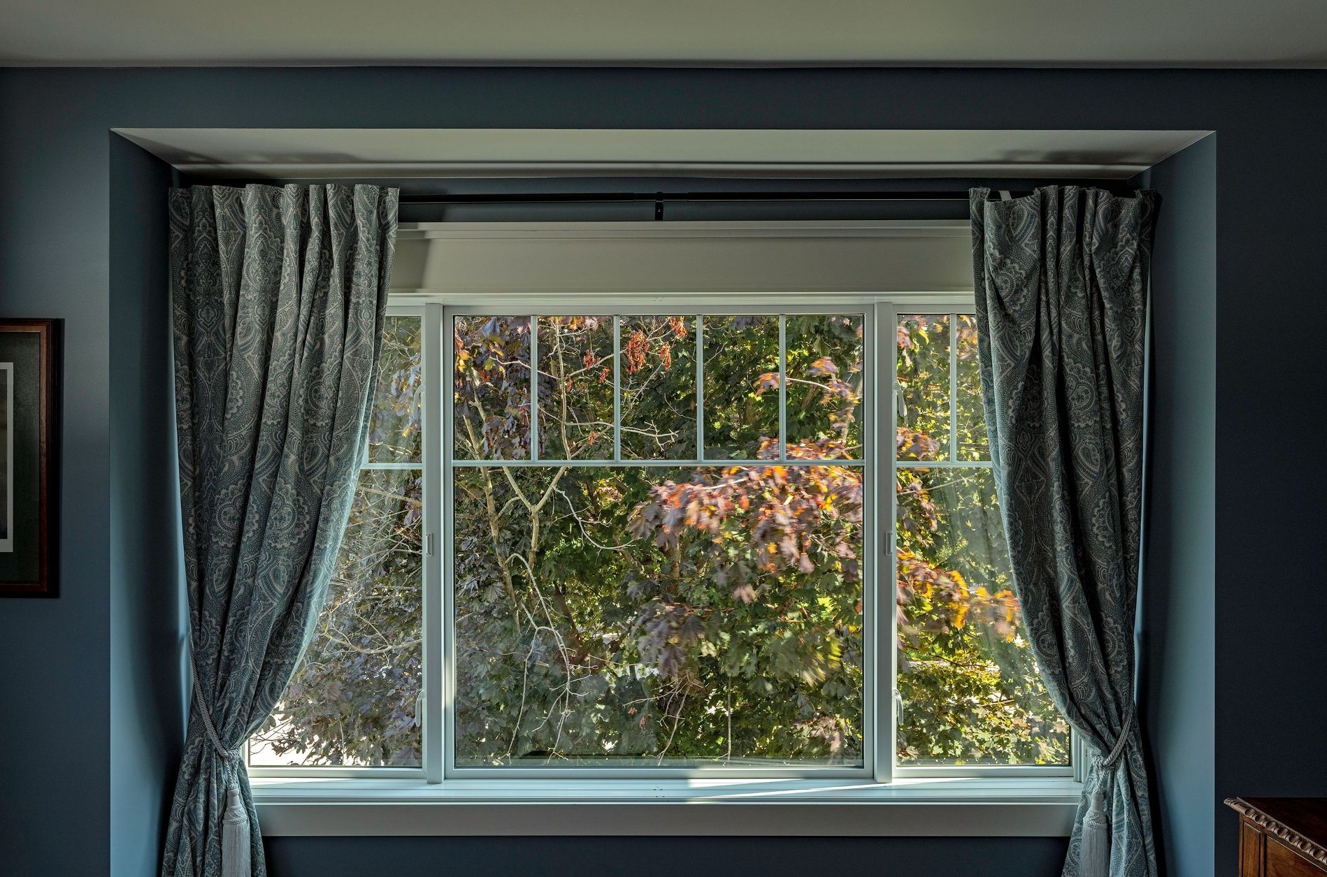 living room with curtains and solar shades