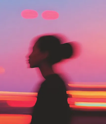 Silhouette floue d'une femme de profil avec un chignon contre un ciel aux couleurs dégradées de rose et violet au coucher du soleil avec des traînées lumineuses rouges et orange à l'arrière-plan.